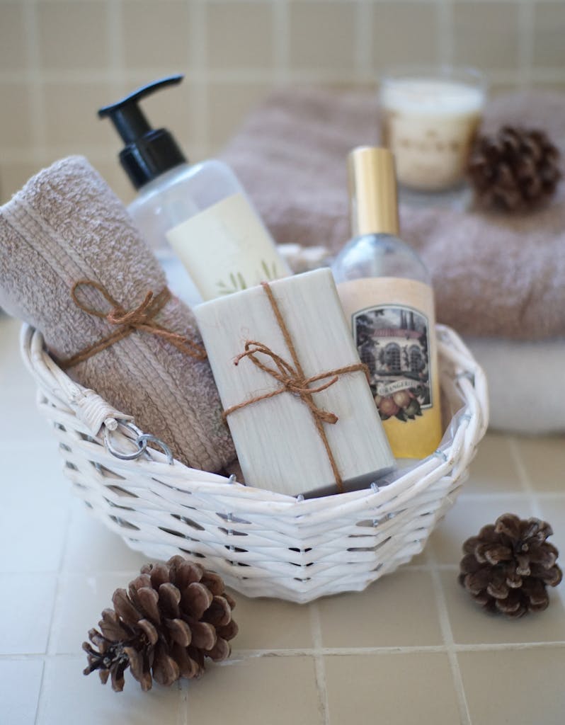 Luxurious spa basket featuring soaps, towels, and skincare products for a relaxing bath experience.